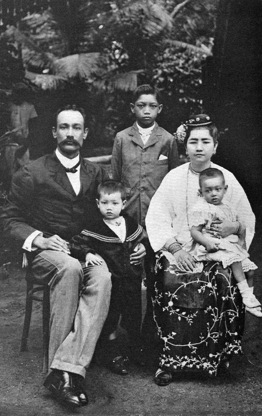 A family portrait of a man, a woman and children in Burma, from a 1904 travel book.